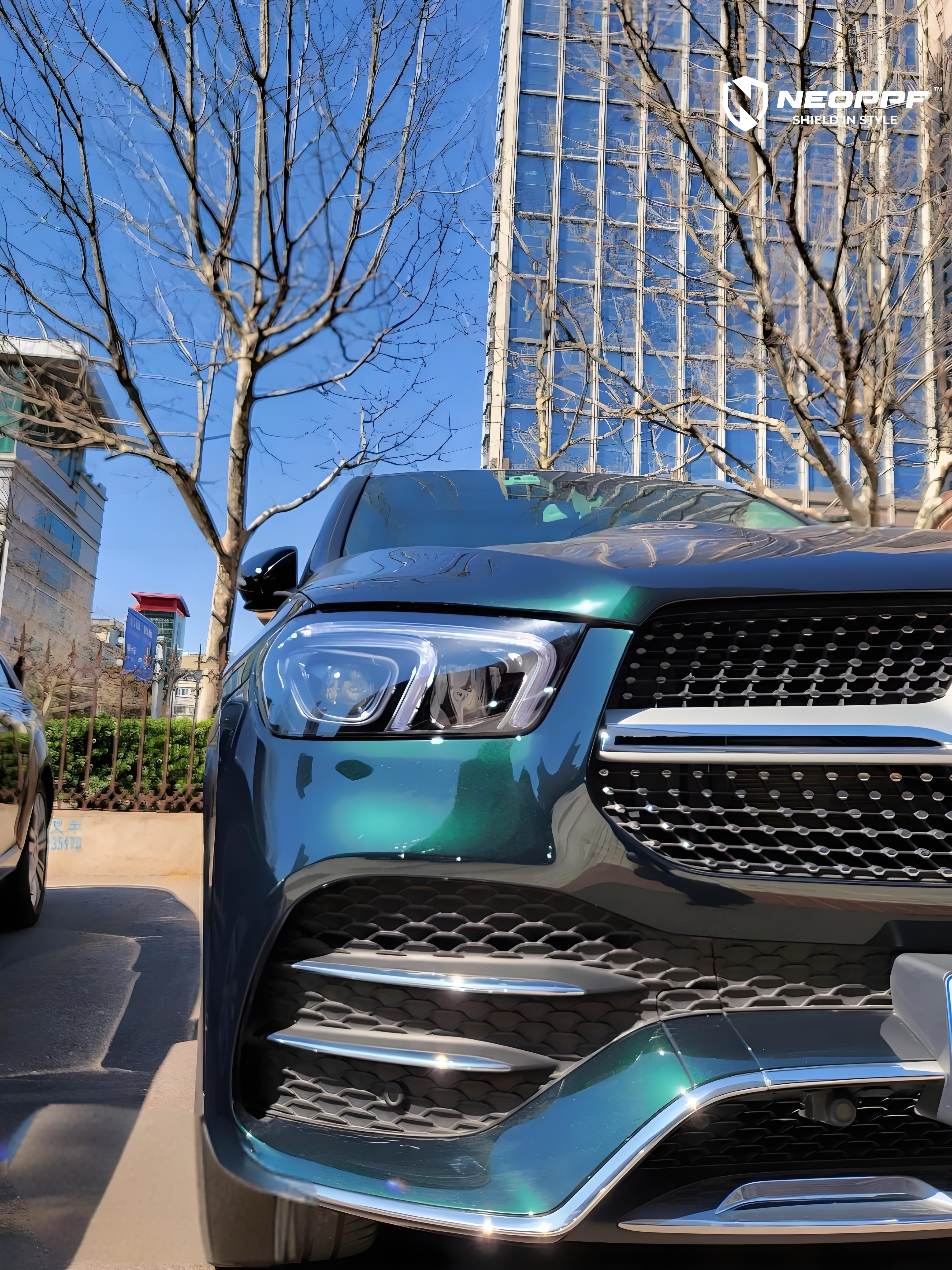 A sports car with Emerald Green Metallic paint protection film colored wrap is parking in the garage