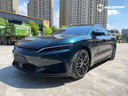 A sports car with Verdant Green paint protection film colored wrap is parking in the garage