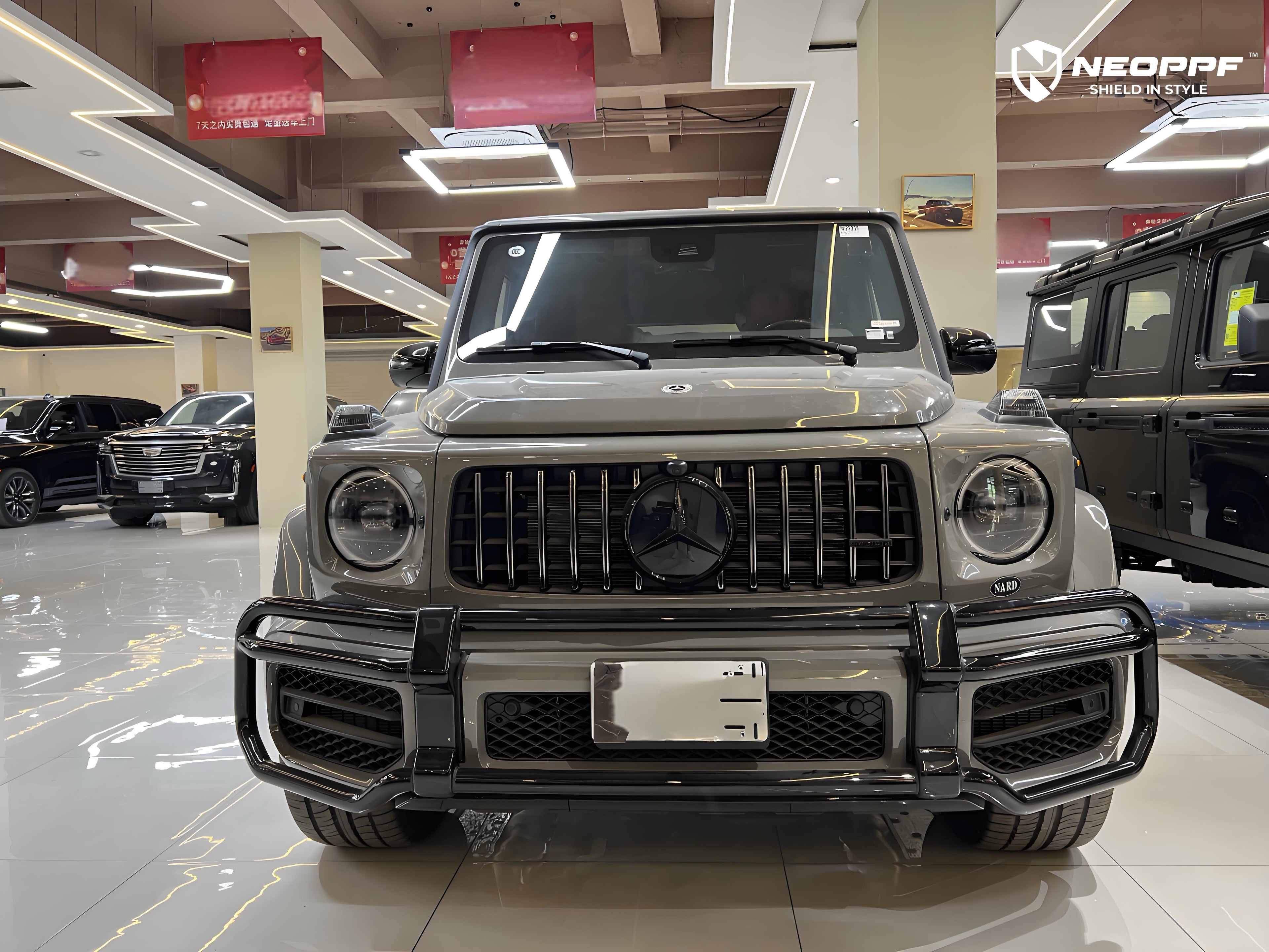 A sports car with Arabian Gray paint protection film colored wrap is parking in the garage