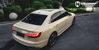 A sports car with Sahara Yellow paint protection film colored wrap is parking in the garage