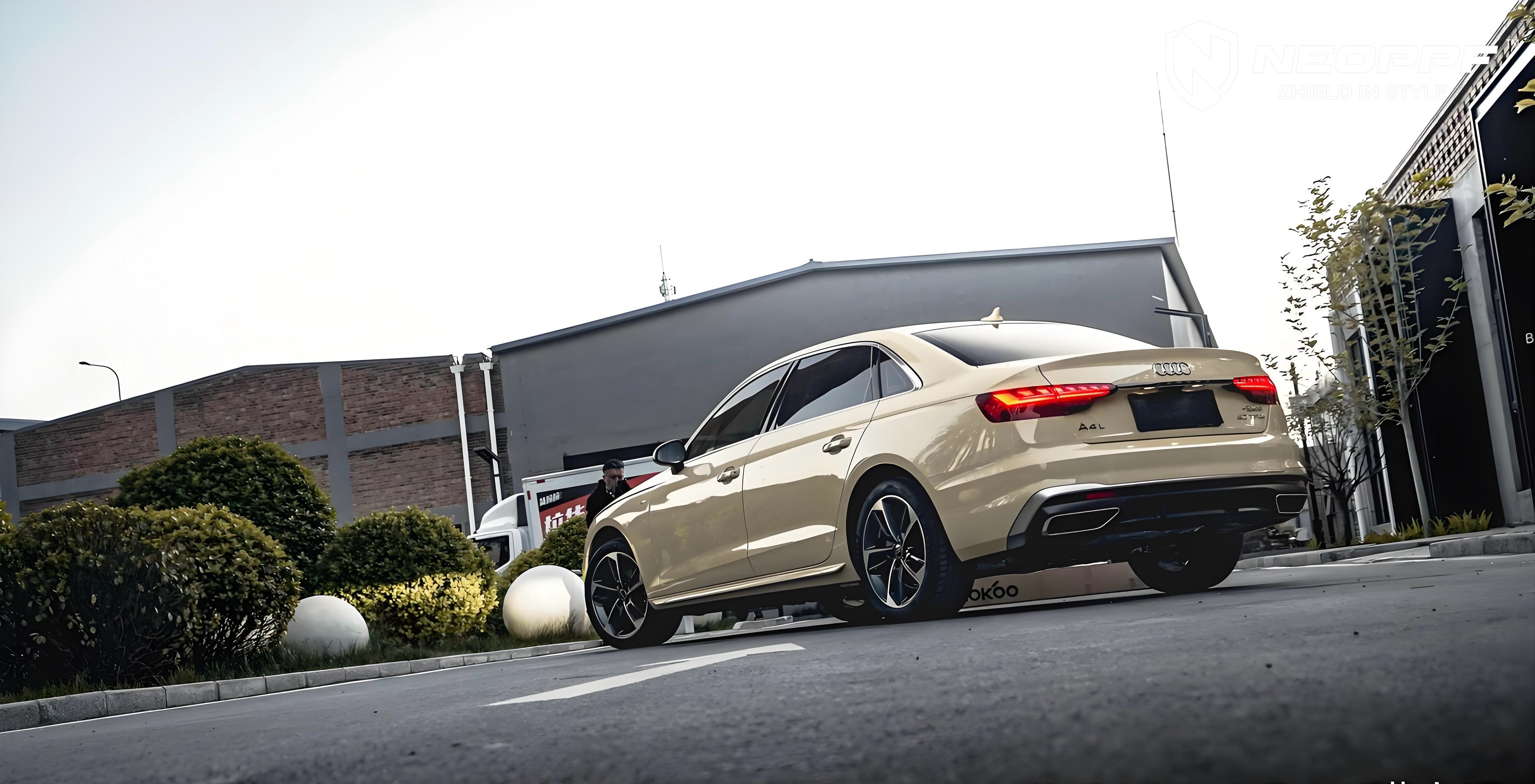 A sports car with Sahara Yellow paint protection film colored wrap is parking in the garage