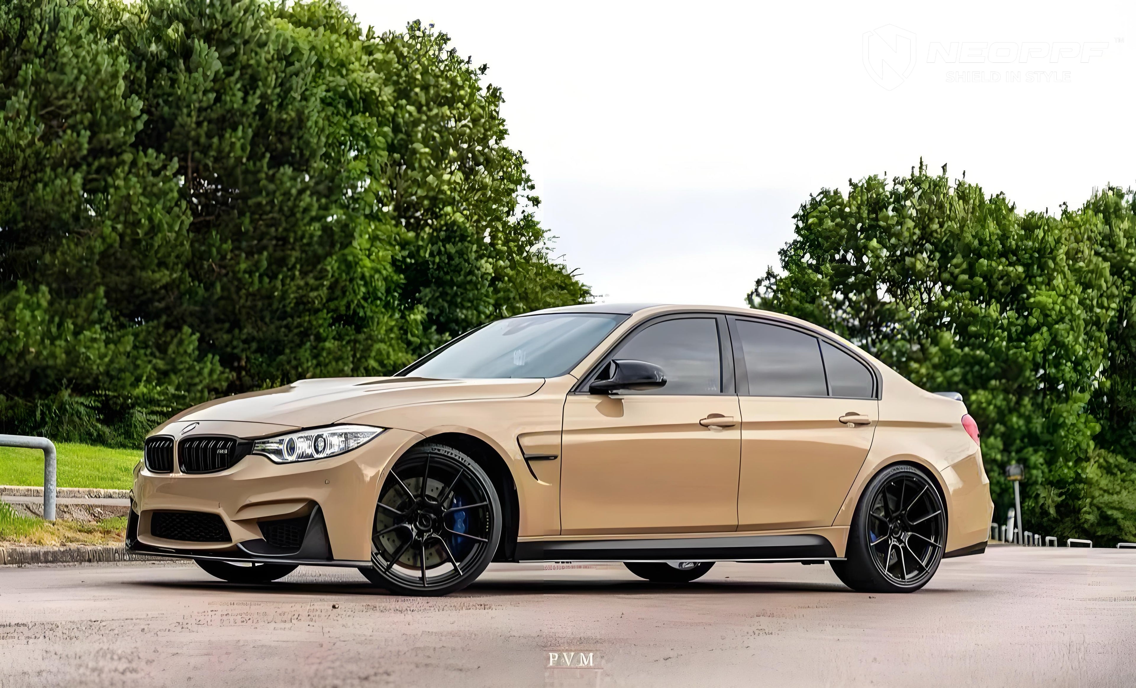 A sports car with Desert Storm paint protection film colored wrap is parking in the garage