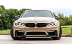 A sports car with Desert Storm paint protection film colored wrap is parking in the garage