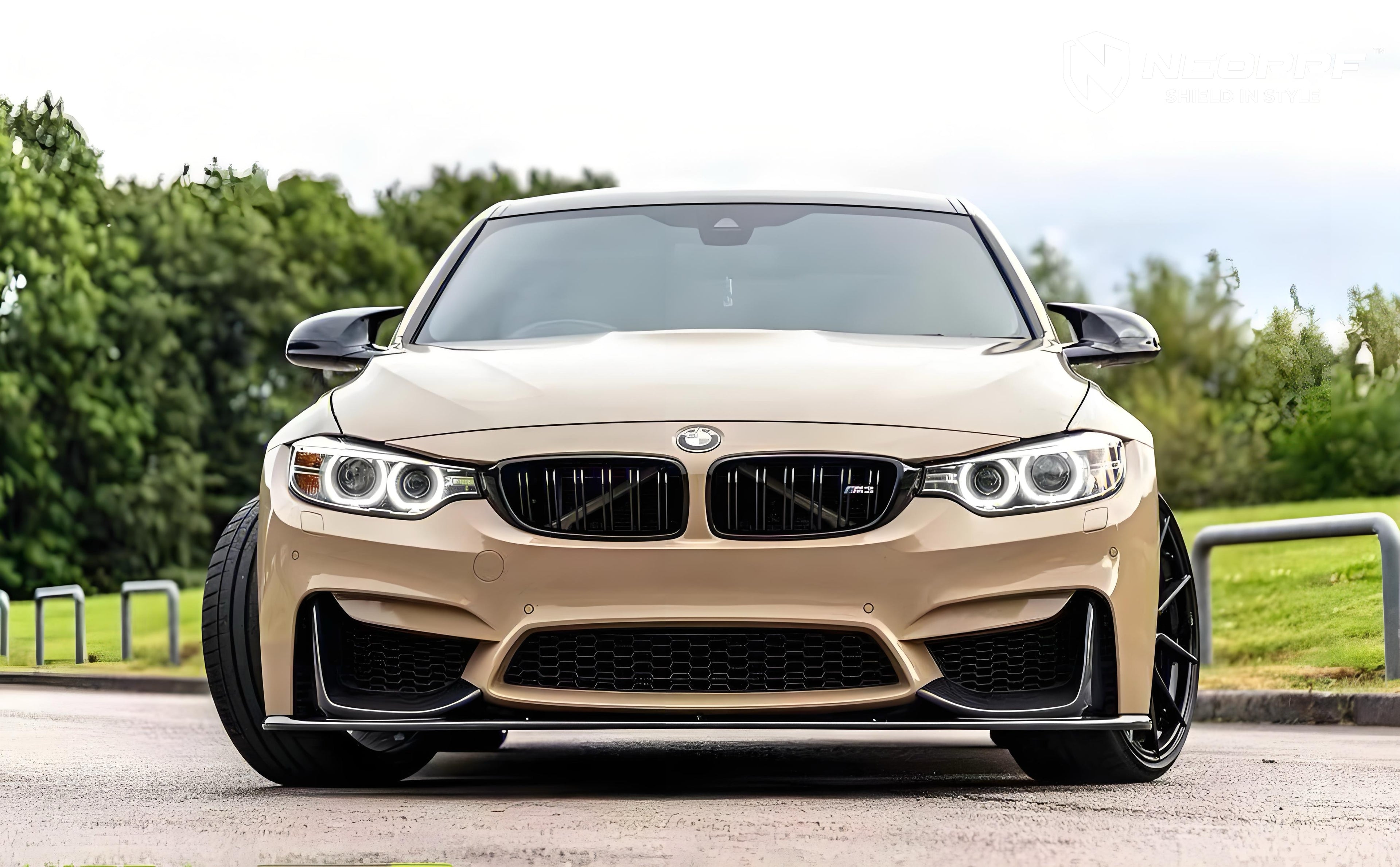 A sports car with Desert Storm paint protection film colored wrap is parking in the garage