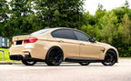 A sports car with Desert Storm paint protection film colored wrap is parking in the garage