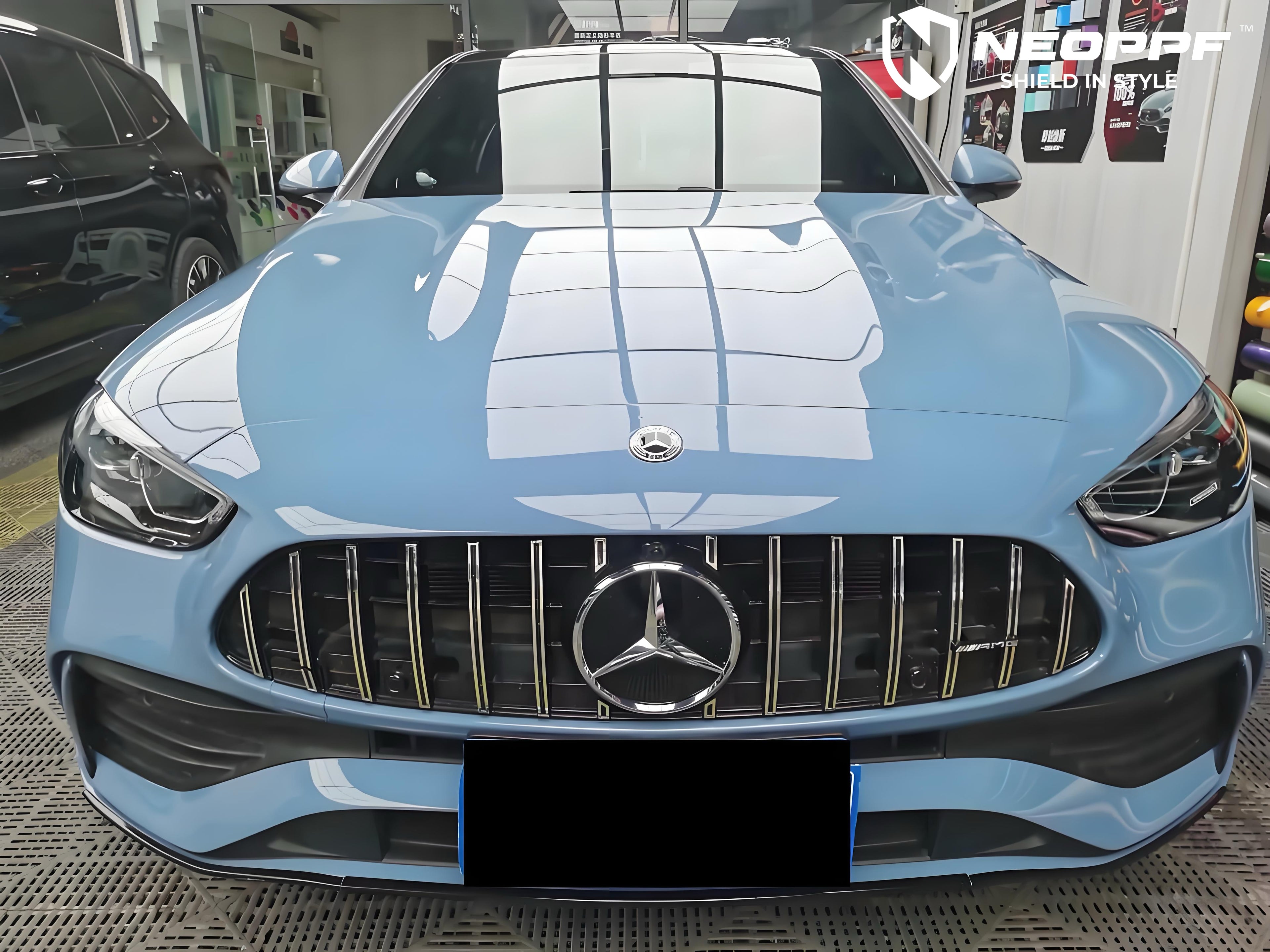 A sports car with Porcelain Blue paint protection film colored wrap is parking in the garage