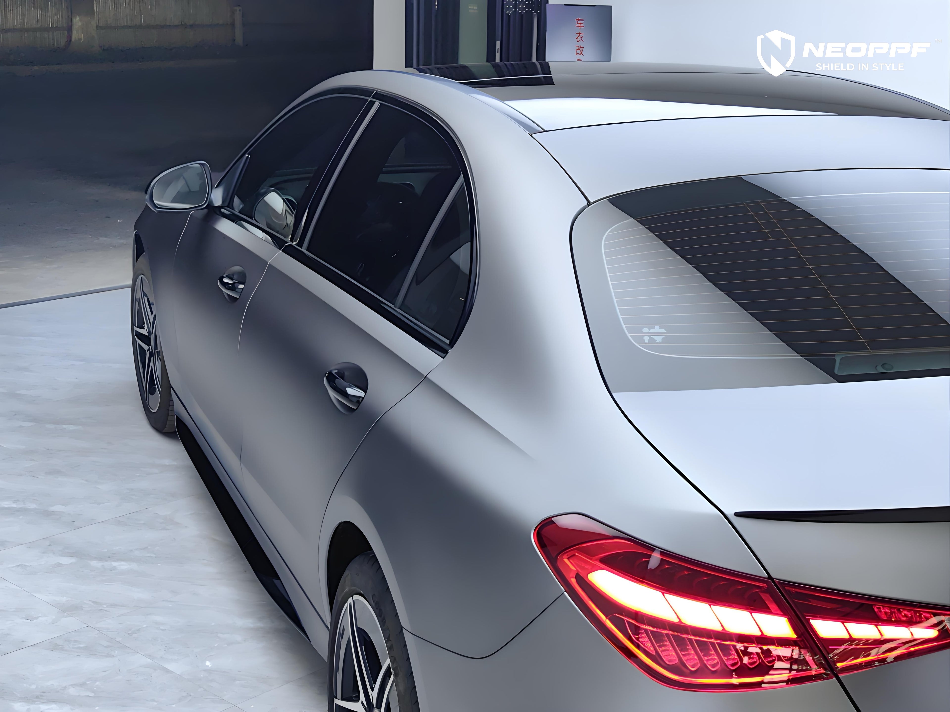A sports car with Volcanic Gray paint protection film colored wrap is parking in the garage