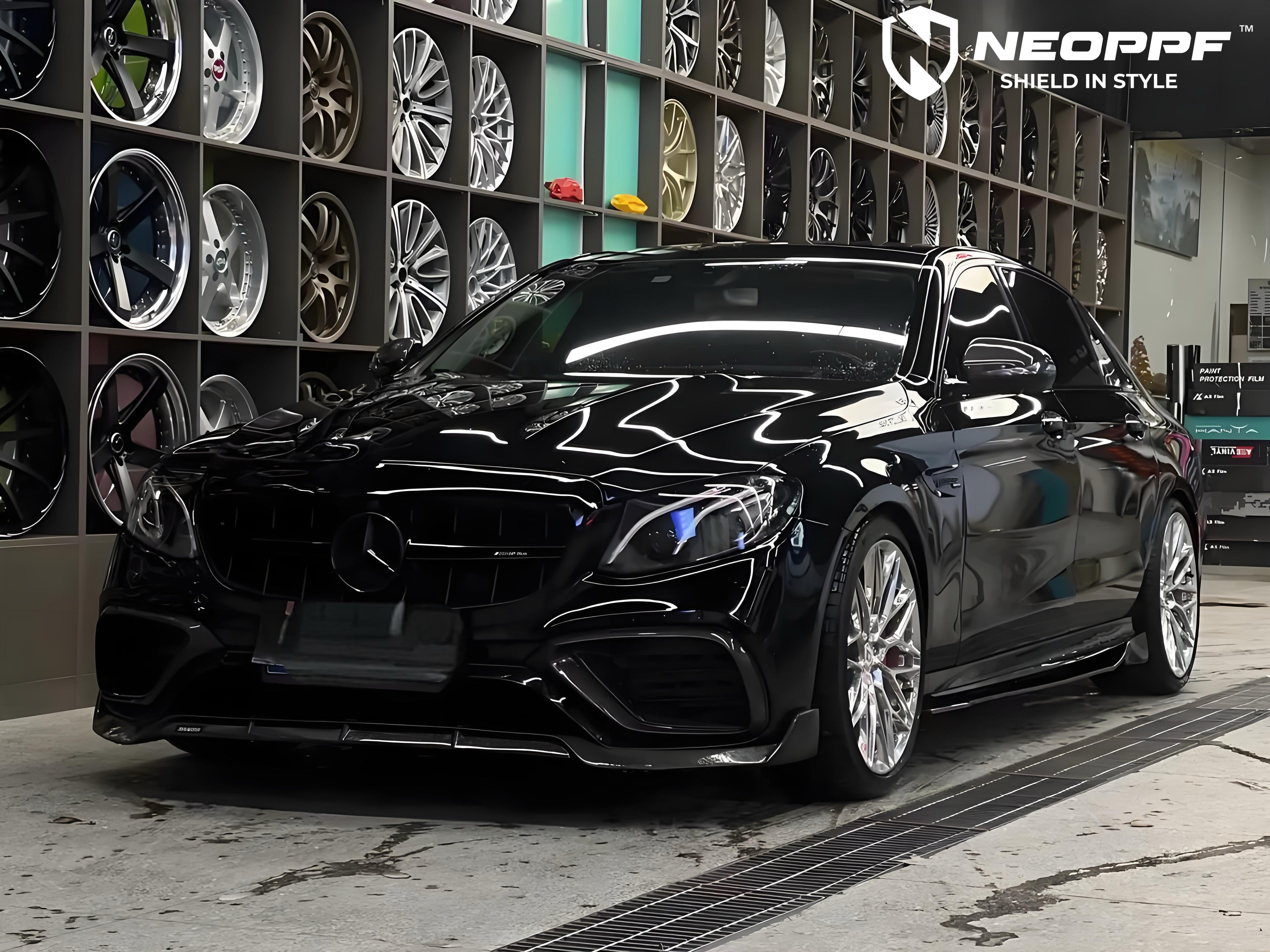 A sports car with Super Black paint protection film colored wrap is parking in the garage