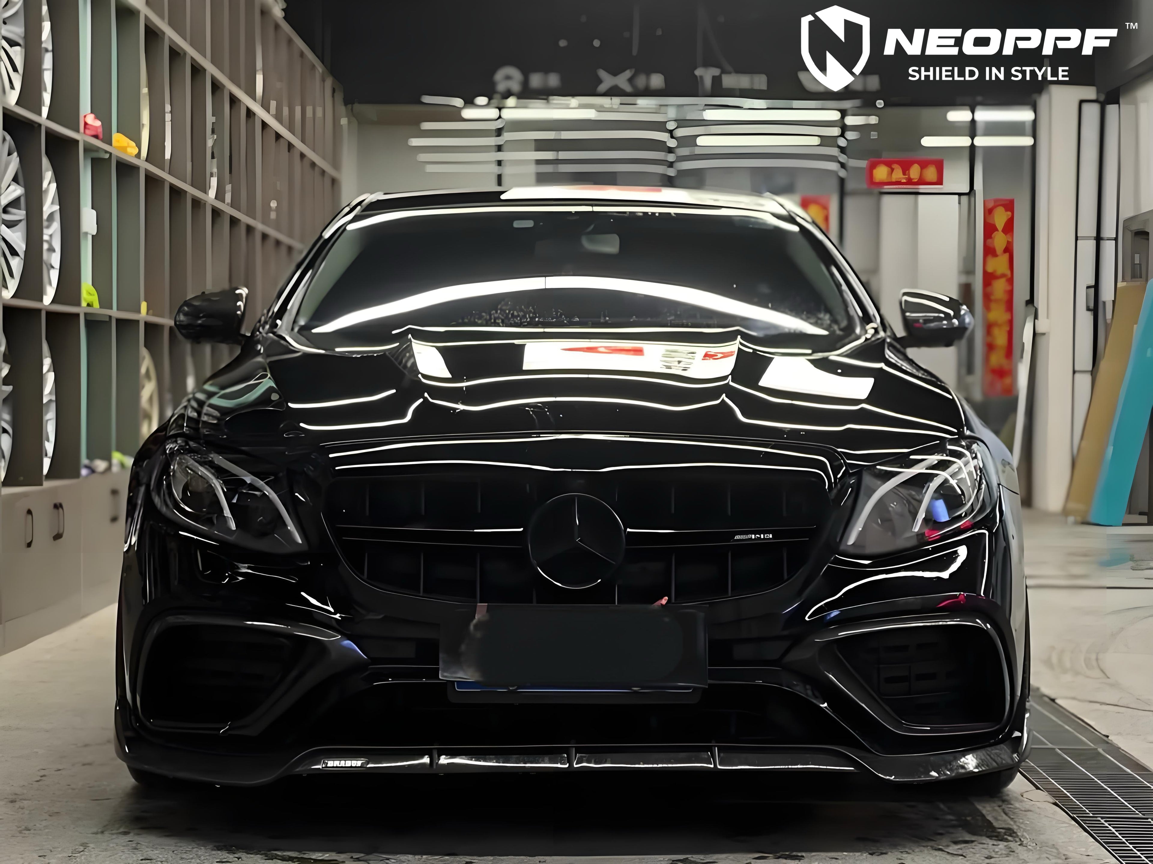 A sports car with Super Black paint protection film colored wrap is parking in the garage