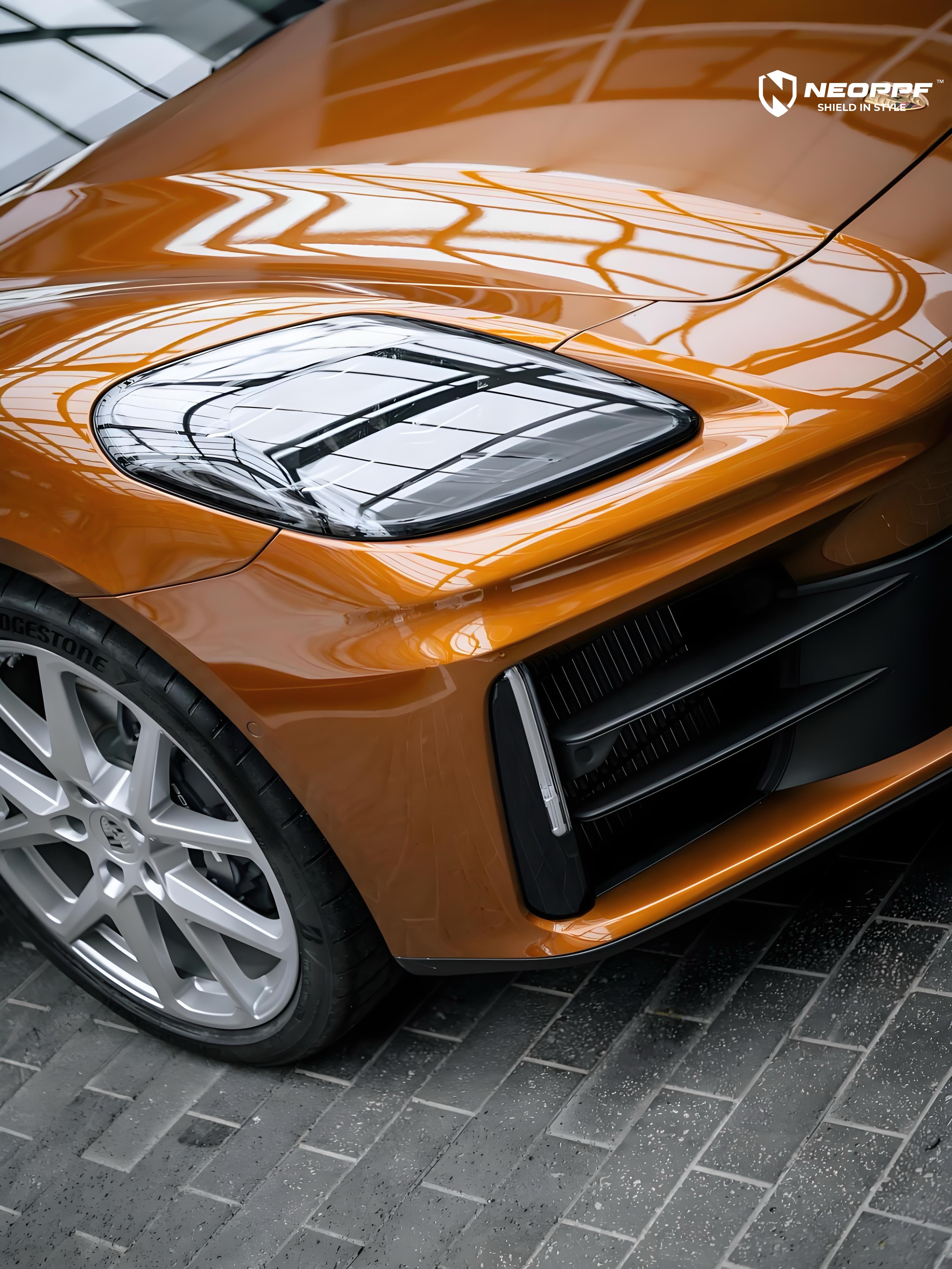A sports car with Liquid Metallic Madeira Gold paint protection film colored wrap is parking in the garage