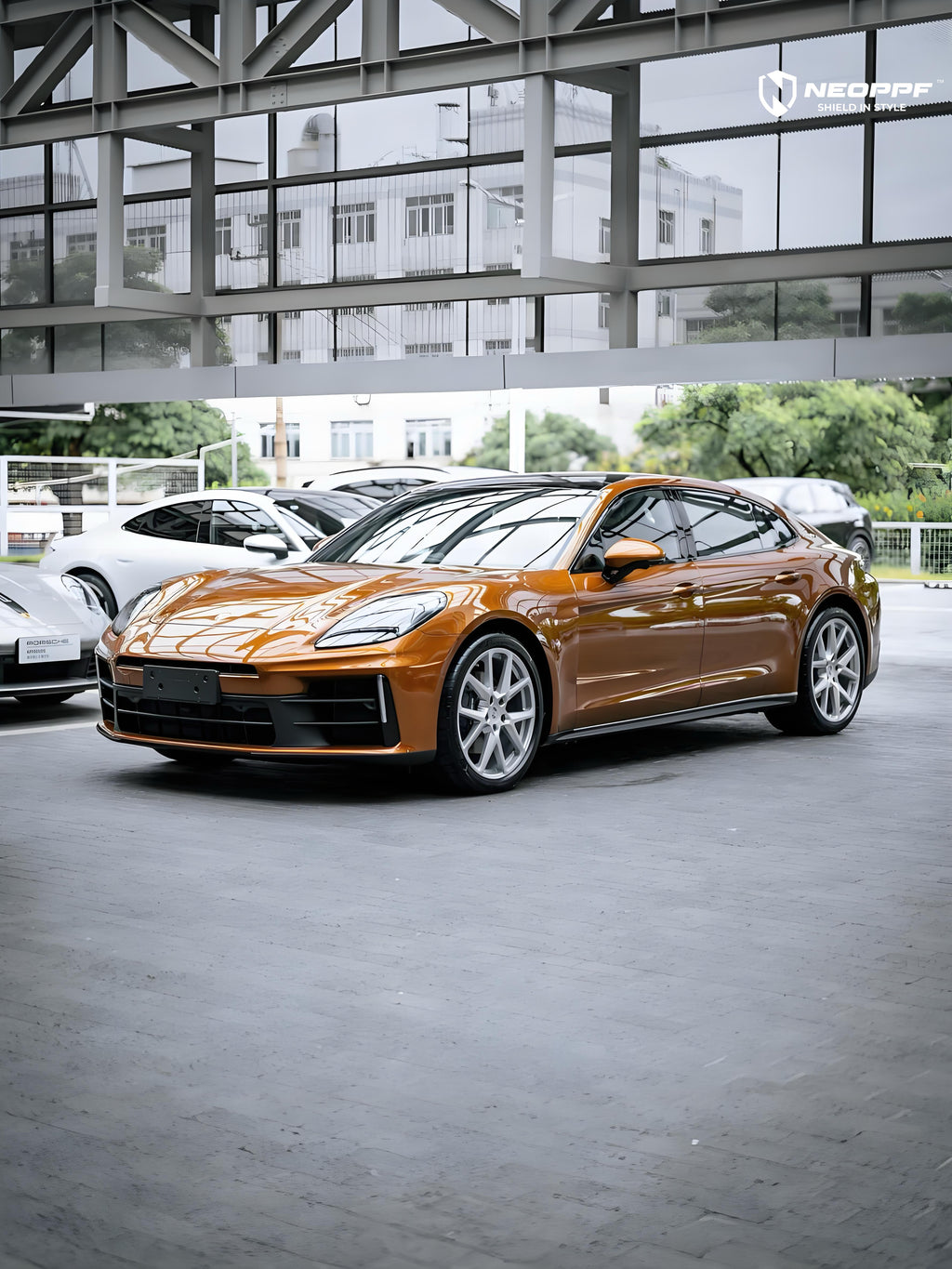 A sports car with Liquid Metallic Madeira Gold paint protection film colored wrap is parking in the garage