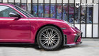 A sports car with Glazed Tata Red paint protection film colored wrap is parking in the garage