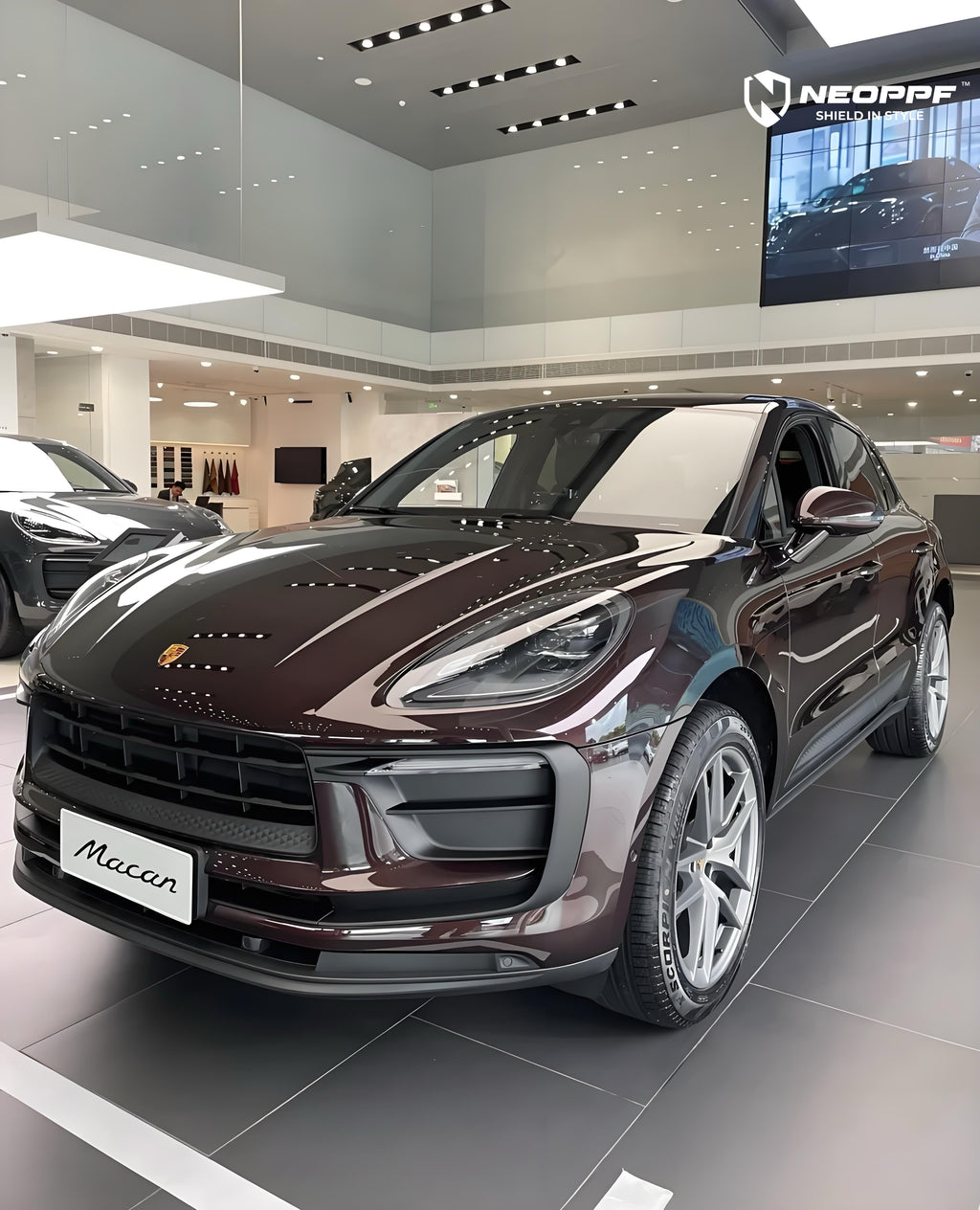 A sports car with Peach Rosewood paint protection film colored wrap is parking in the garage