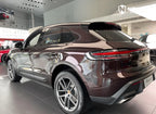 A sports car with Peach Rosewood paint protection film colored wrap is parking in the garage