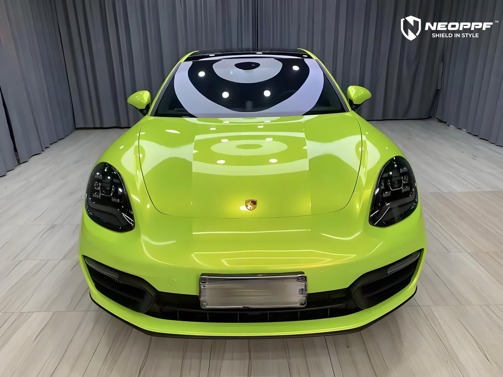 A sports car with Peridot Metallic paint protection film colored wrap is parking in the garage