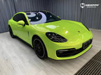 A sports car with Peridot Metallic paint protection film colored wrap is parking in the garage