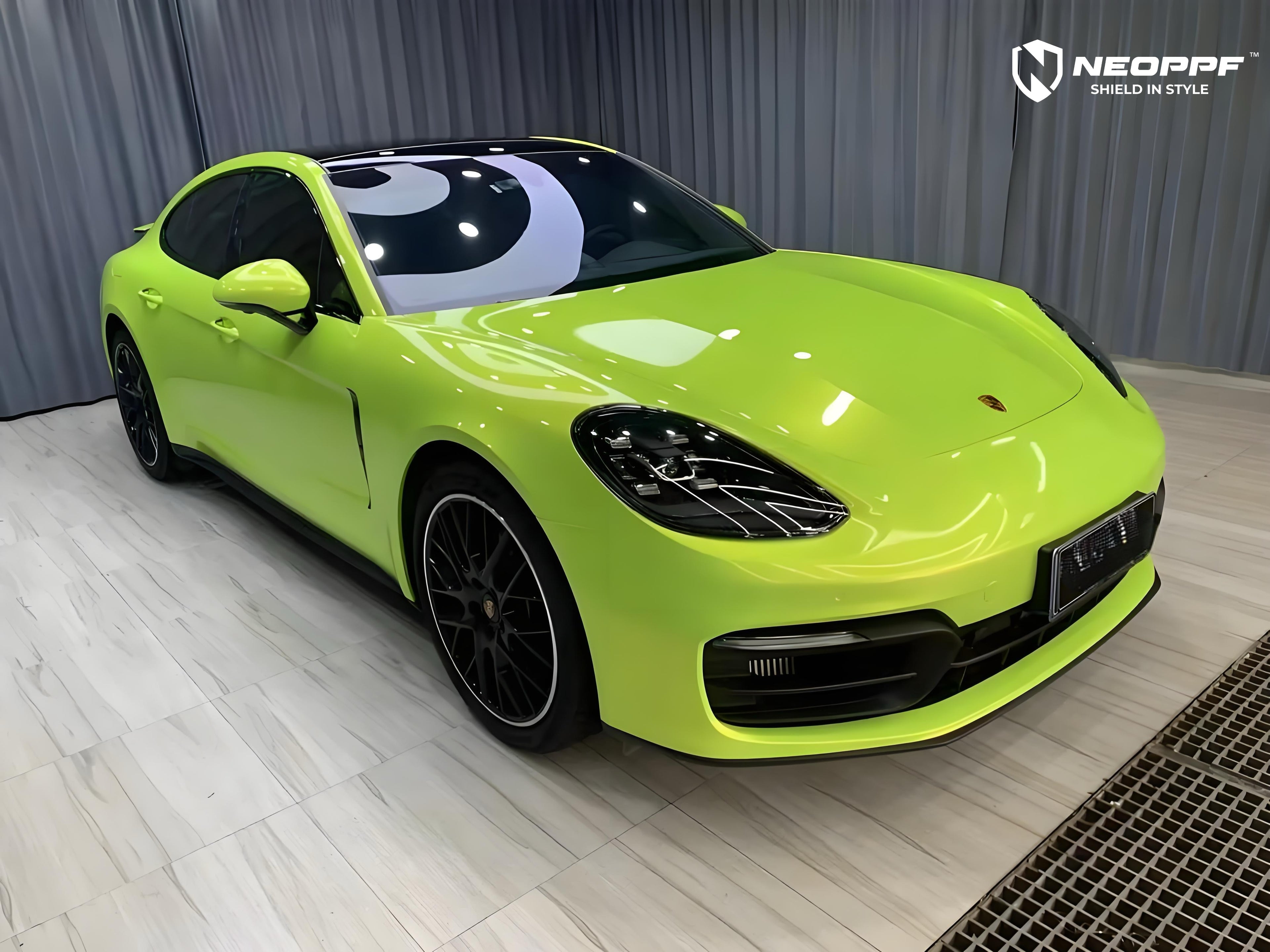A sports car with Peridot Metallic paint protection film colored wrap is parking in the garage