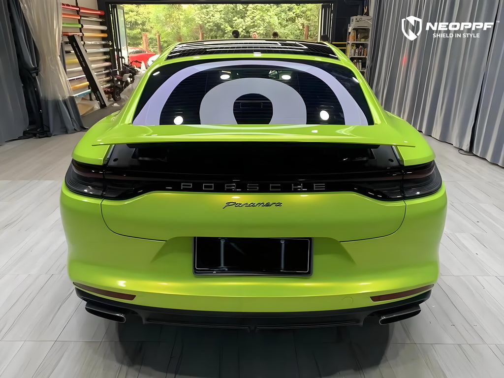 A sports car with Peridot Metallic paint protection film colored wrap is parking in the garage