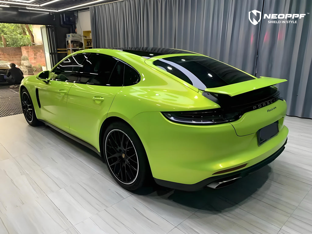 A sports car with Peridot Metallic paint protection film colored wrap is parking in the garage