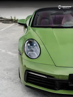 A sports car with Olive Green paint protection film colored wrap is parking in the garage