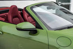 A sports car with Olive Green paint protection film colored wrap is parking in the garage