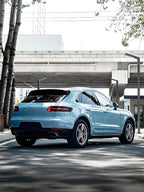 A sports car with Glacier Blue Metallic paint protection film colored wrap is parking in the garage