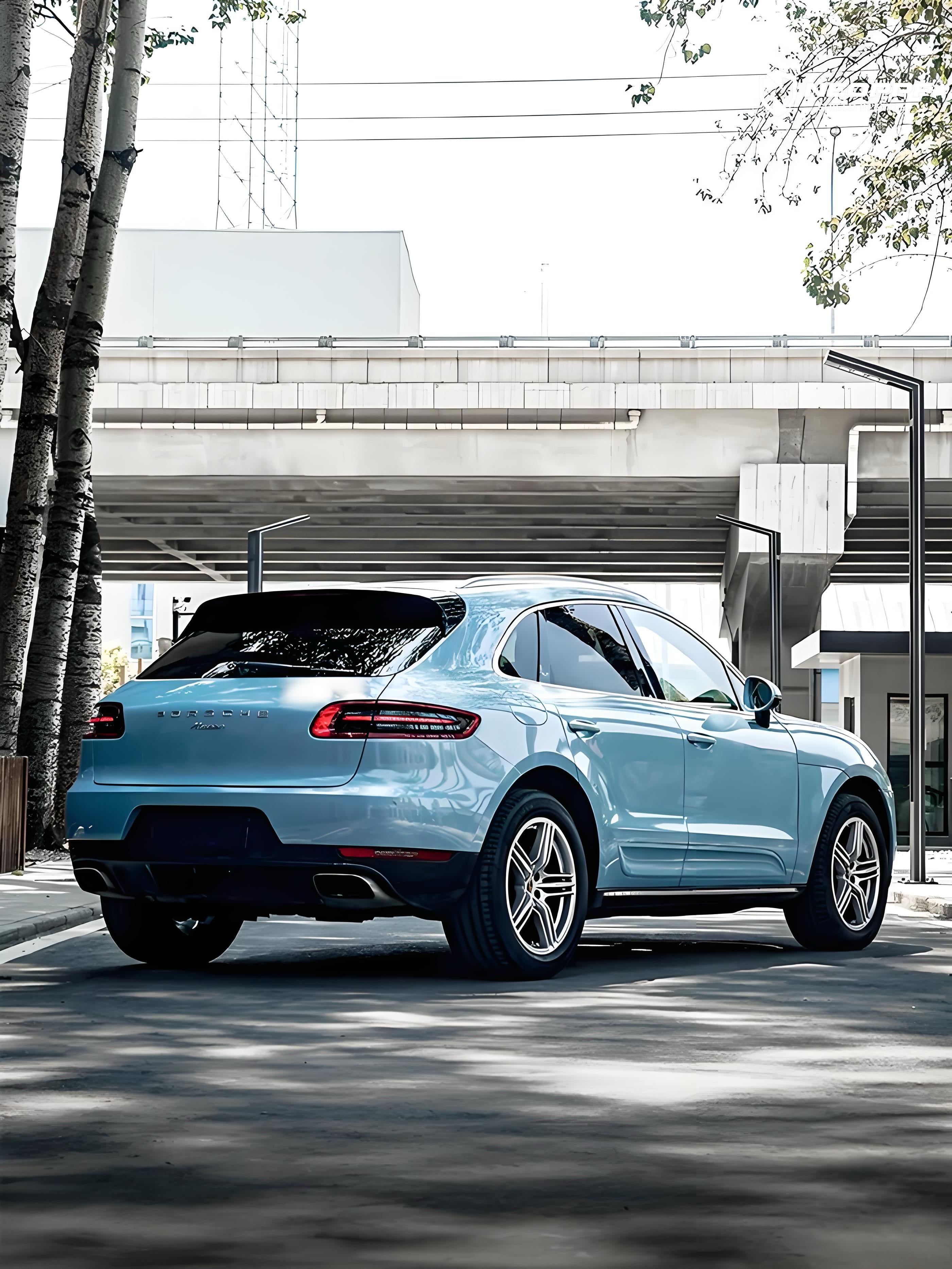 A sports car with Glacier Blue Metallic paint protection film colored wrap is parking in the garage