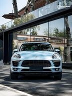 A sports car with Glacier Blue Metallic paint protection film colored wrap is parking in the garage