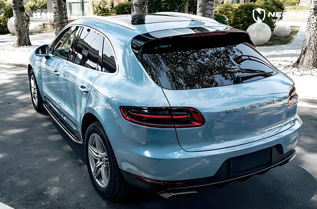 A sports car with Glacier Blue Metallic paint protection film colored wrap is parking in the garage