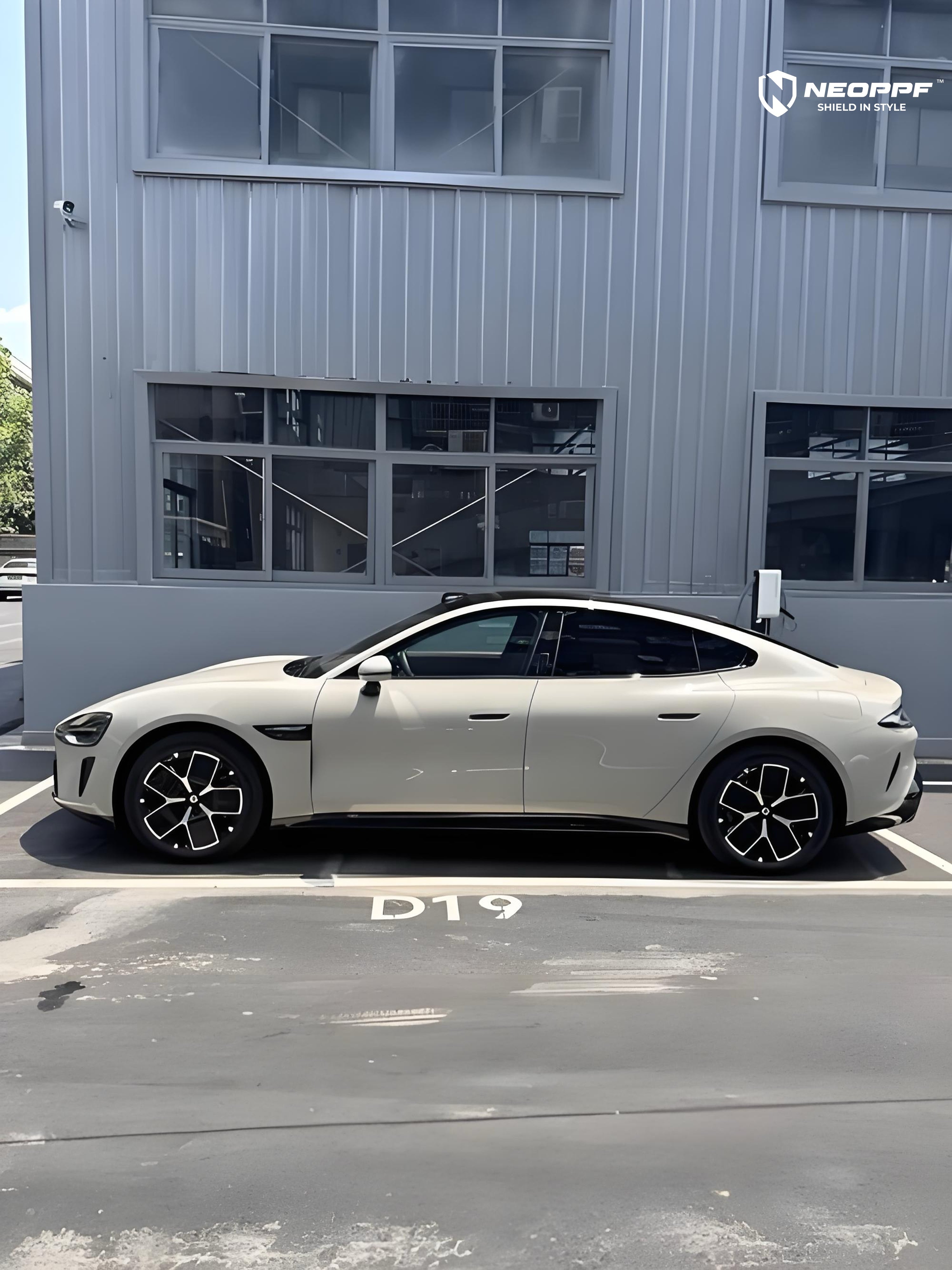 A sports car with Elegant Gray paint protection film colored wrap is parking in the garage
