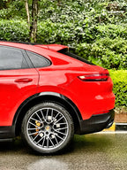 A sports car with Crystal Orange Red paint protection film colored wrap is parking in the garage