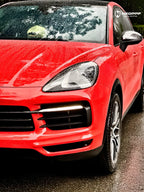 A sports car with Crystal Orange Red paint protection film colored wrap is parking in the garage