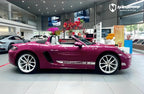 A sports car with Starlight Ruby Red paint protection film colored wrap is parking in the garage