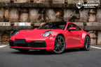 A sports car with Strawberry Red paint protection film colored wrap is parking in the garage