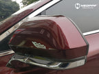 A sports car with Brocade Red paint protection film colored wrap is parking in the garage