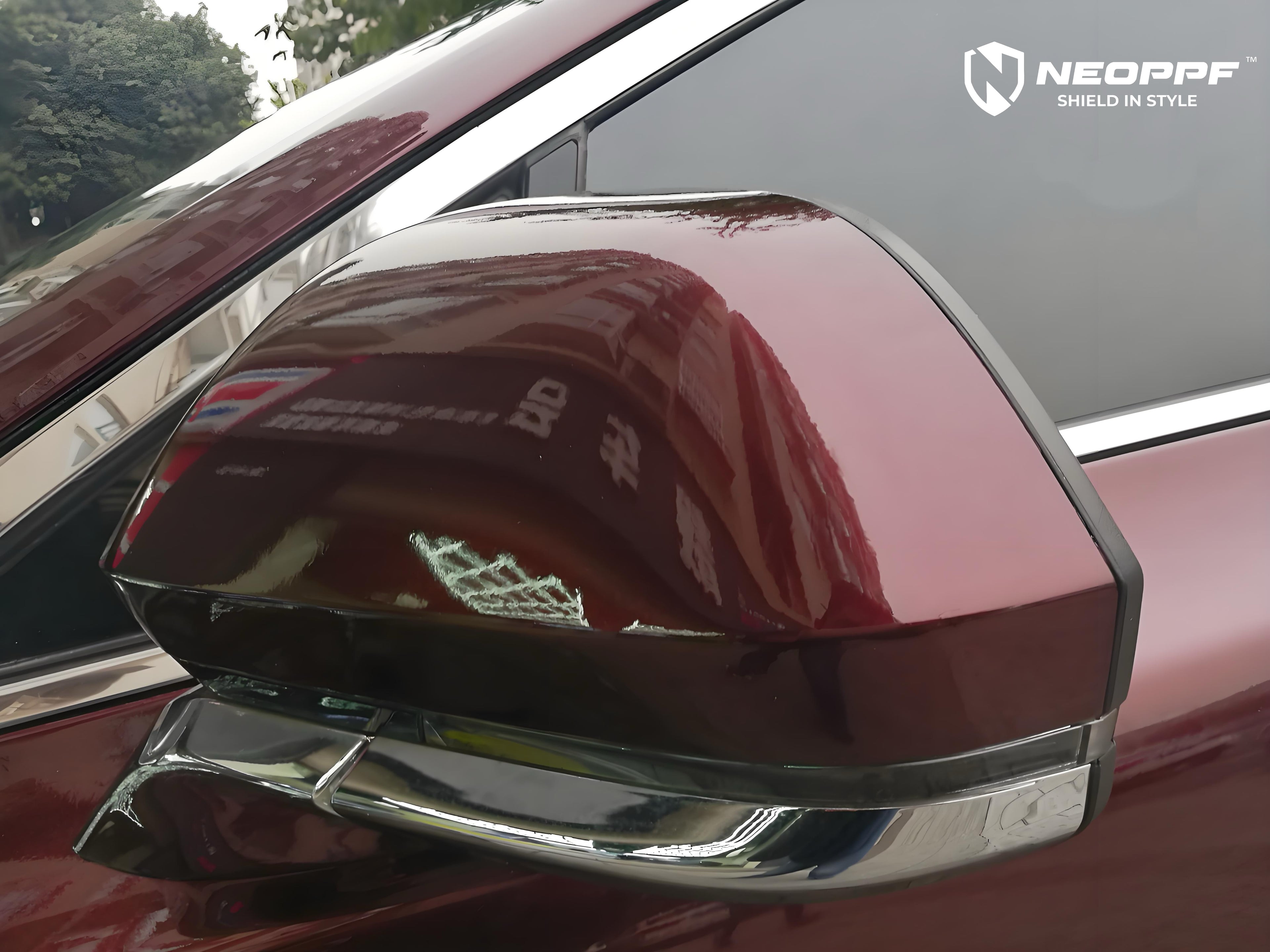 A sports car with Brocade Red paint protection film colored wrap is parking in the garage