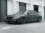 A sports car with British Green Metallic paint protection film colored wrap is parking in the garage