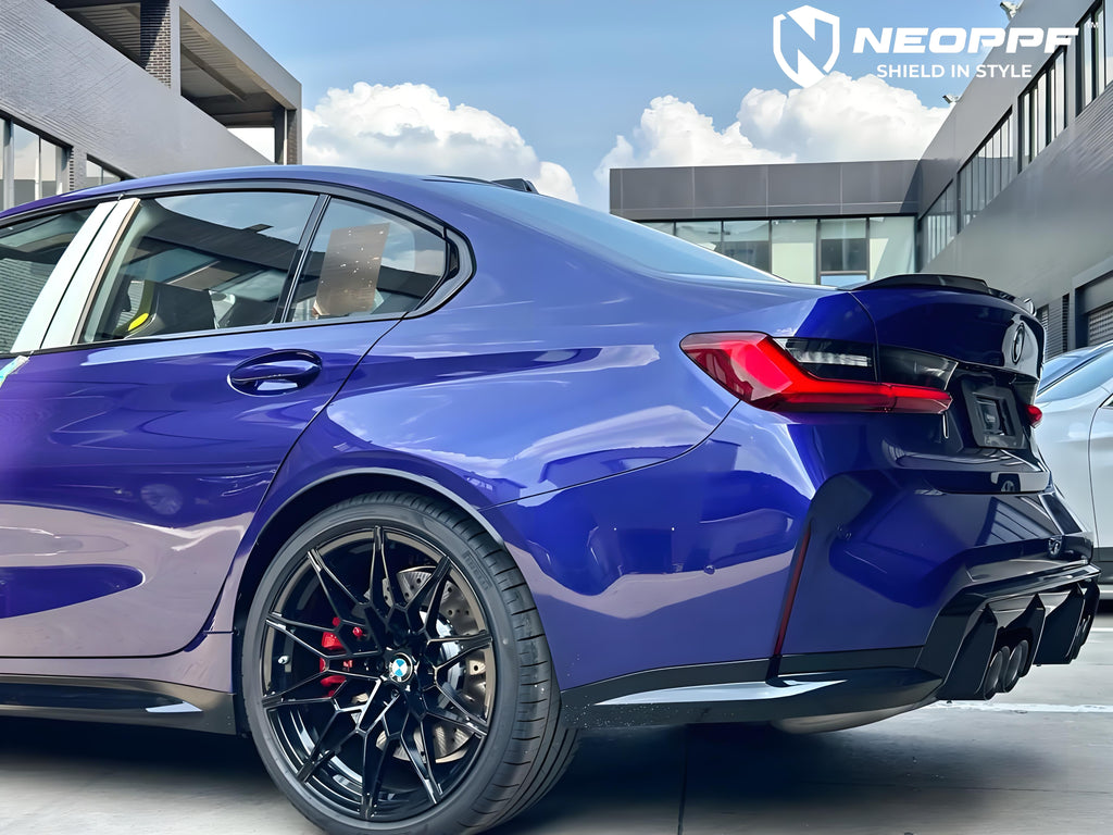A sports car with Velvet Blue paint protection film colored wrap is parking in the garage