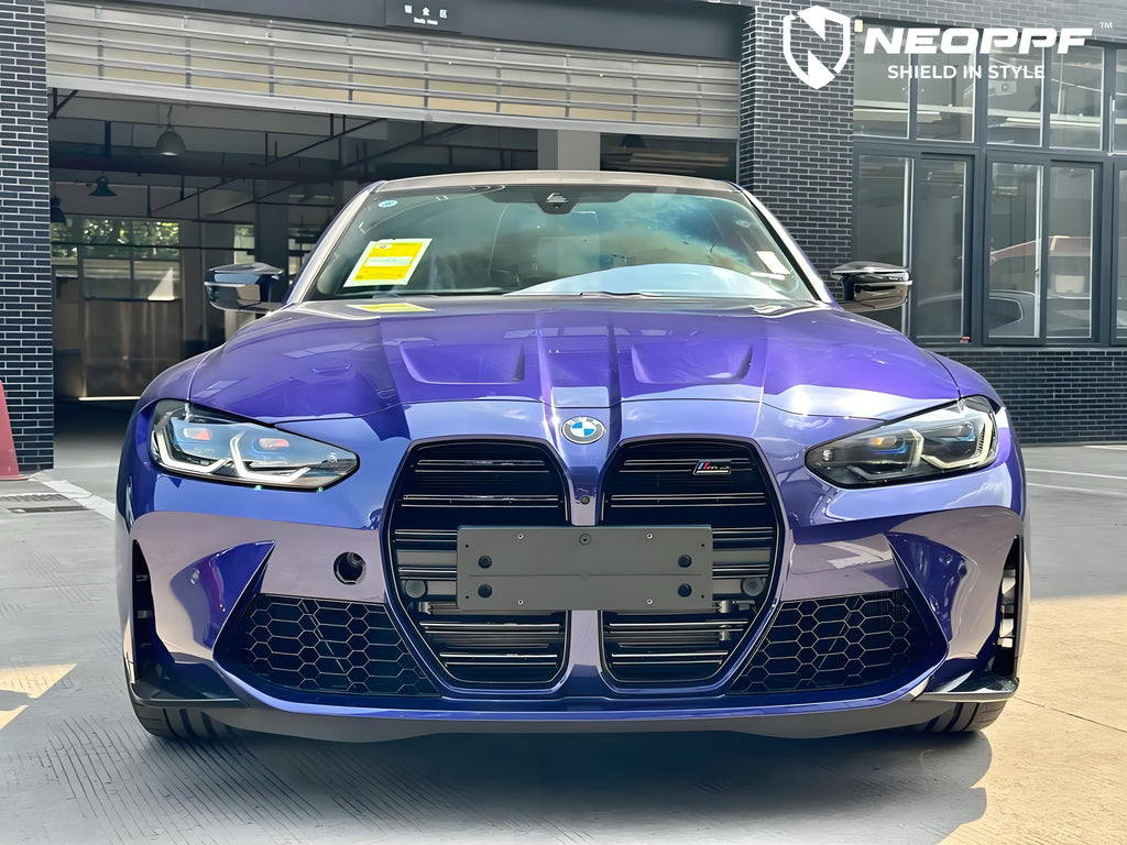 A sports car with Velvet Blue paint protection film colored wrap is parking in the garage