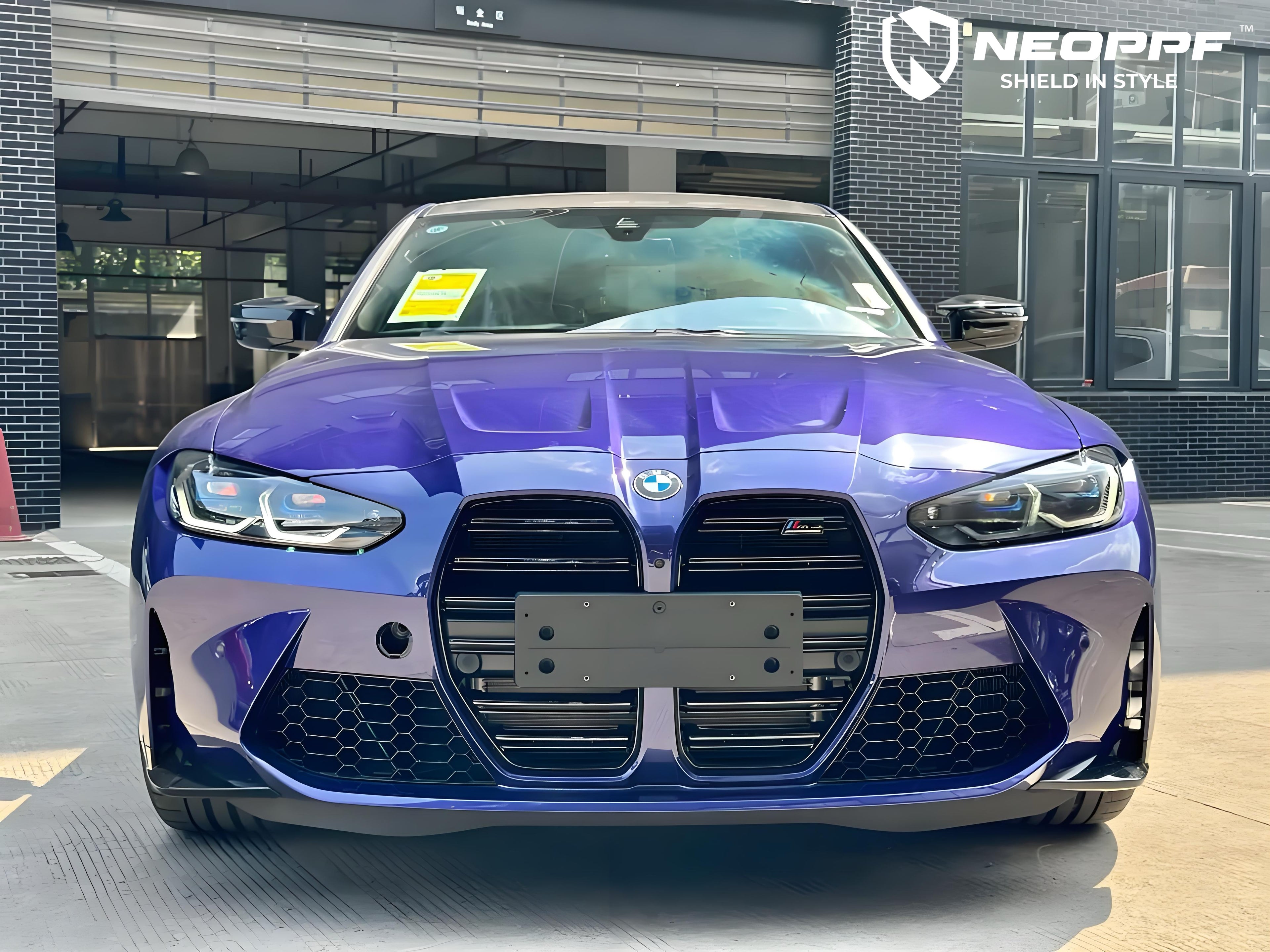 A sports car with Velvet Blue paint protection film colored wrap is parking in the garage