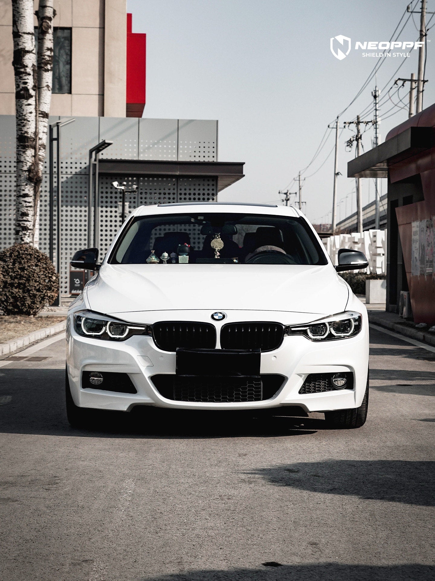A sports car with Mineral White paint protection film colored wrap is parking in the garage