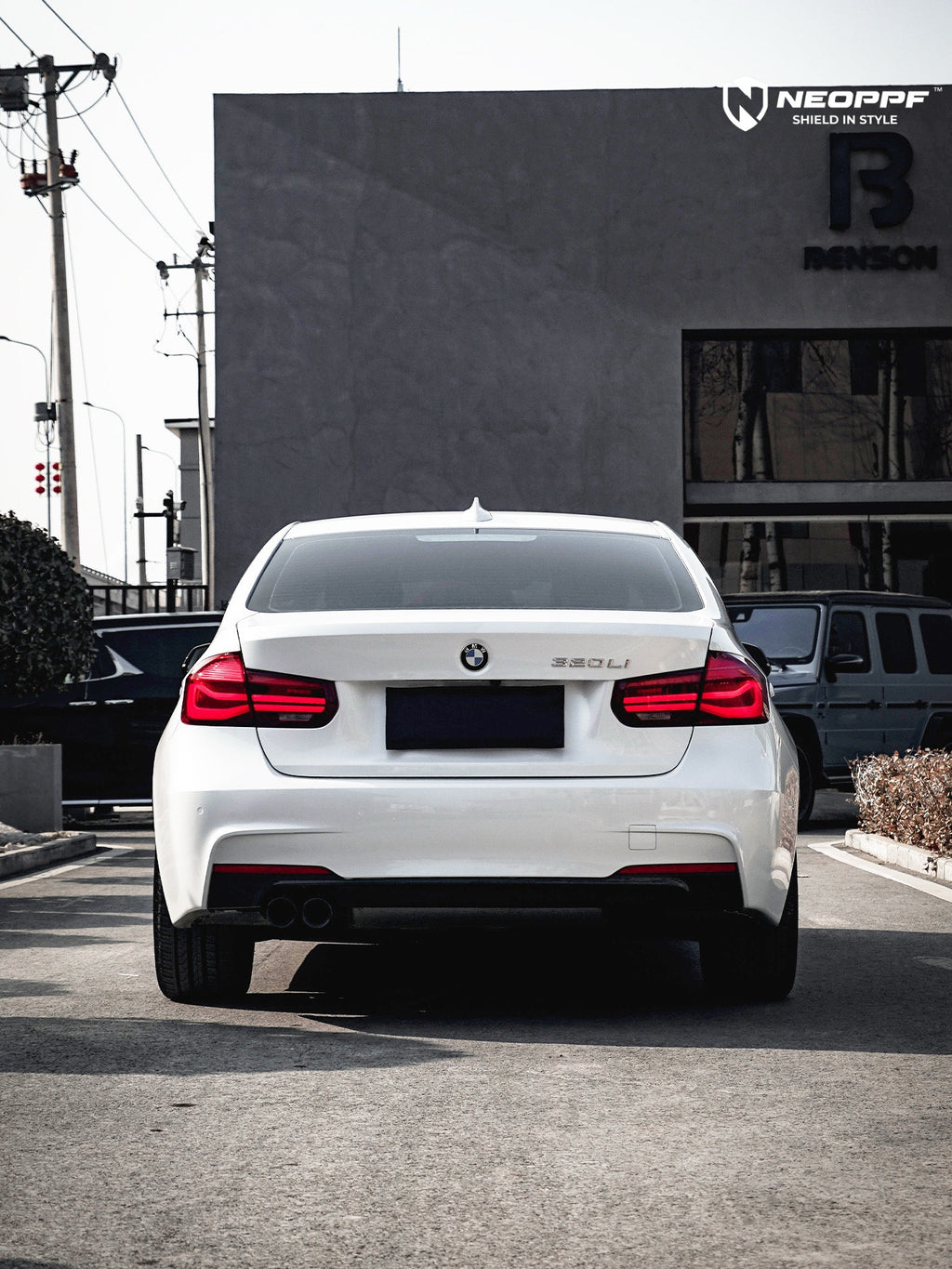 A sports car with Mineral White paint protection film colored wrap is parking in the garage