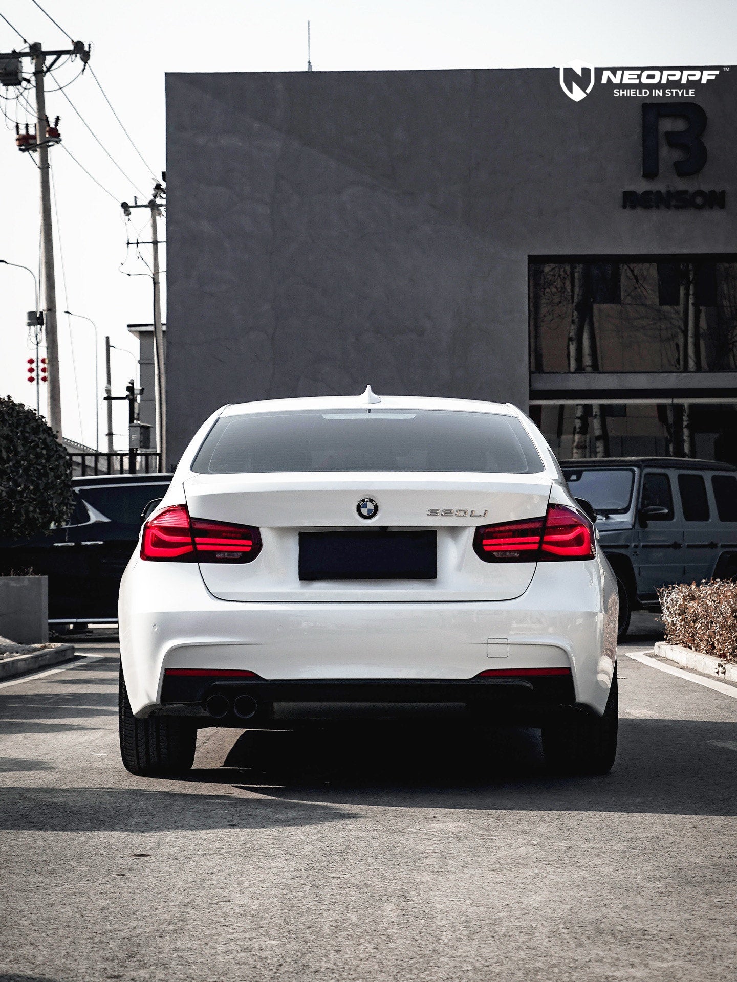 A sports car with Mineral White paint protection film colored wrap is parking in the garage