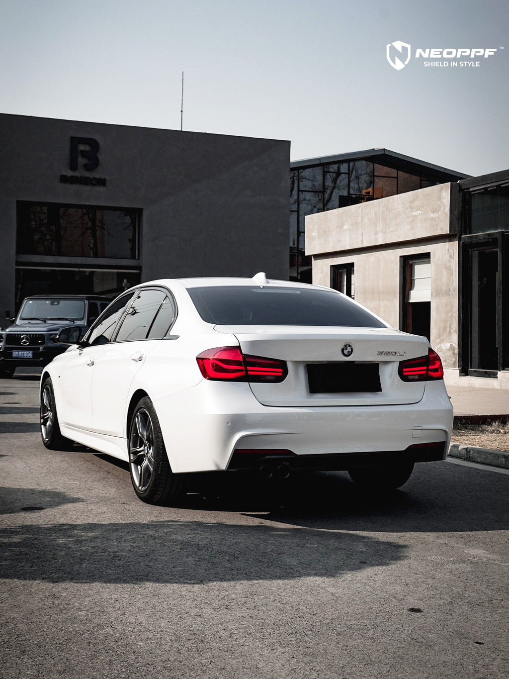 A sports car with Mineral White paint protection film colored wrap is parking in the garage