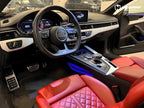 A sports car with Gotland Green paint protection film colored wrap is parking in the garage