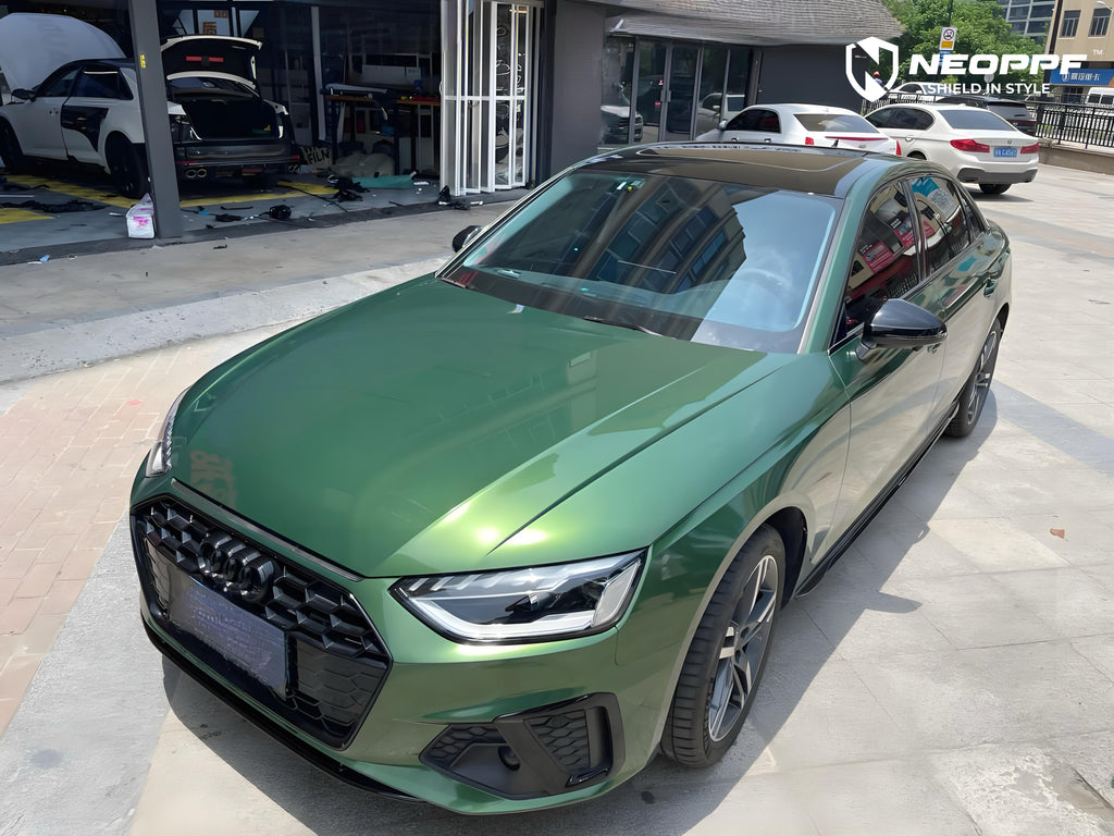 A sports car with Sonoma Green paint protection film colored wrap is parking in the garage