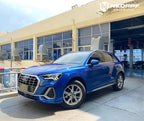 A sports car with Sepang Blue paint protection film colored wrap is parking in the garage