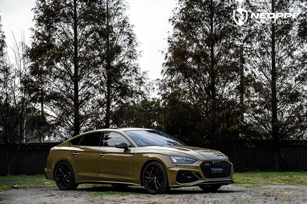 A sports car with Combat Green paint protection film colored wrap is parking in the garage