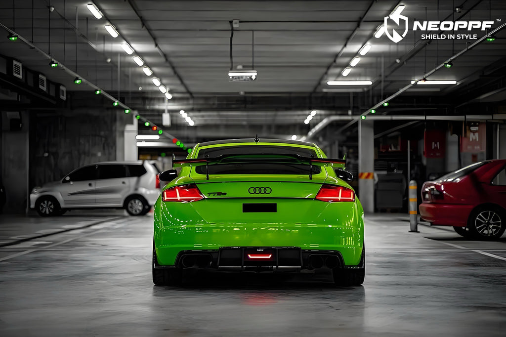 A sports car with Viper Green paint protection film colored wrap is parking in the garage