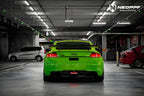 A sports car with Viper Green paint protection film colored wrap is parking in the garage